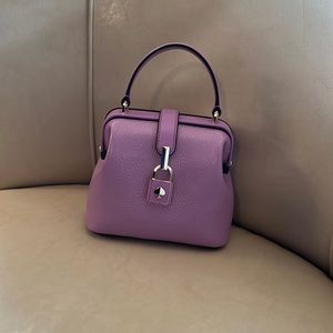 Kate Spade mini top handle purse. Silver hardware with purple locket.